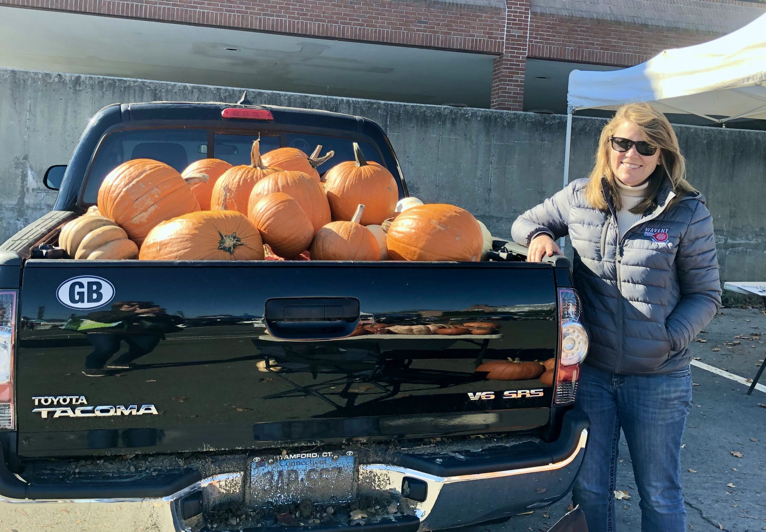 Robin Bates Mason with Truck Full of Pumpkins Pick-up Truck Full with Pumpkins at the New Canaan Farmer's Market